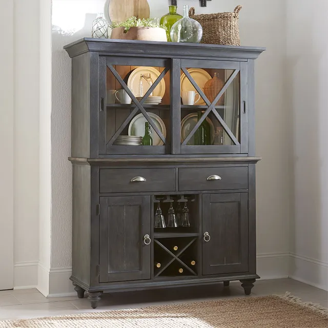 The Liberty Furniture Ocean Isle pine dining room hutch with décor and dinnerware 