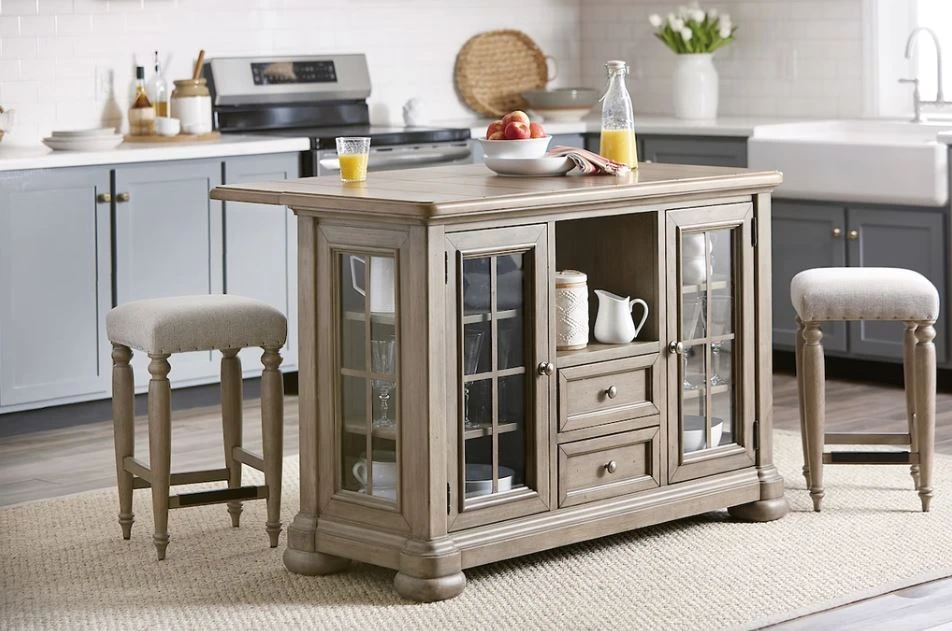 The Klaussner Nashville collection kitchen island shown with matching stools and décor 
