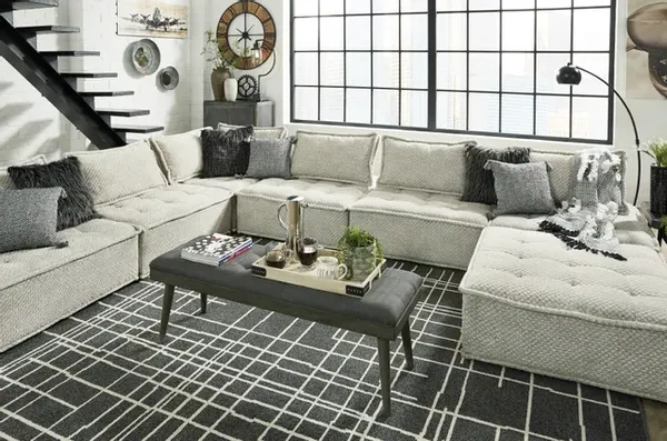 The  Signature Design by Ashley Bales sectional with décor 
