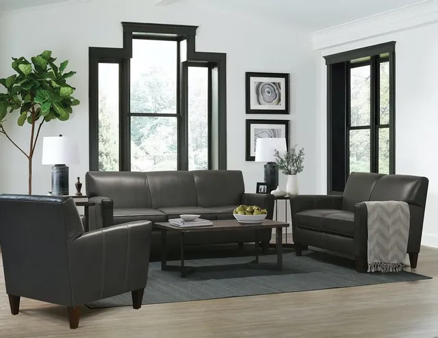Leather loveseat in a living room with other furniture