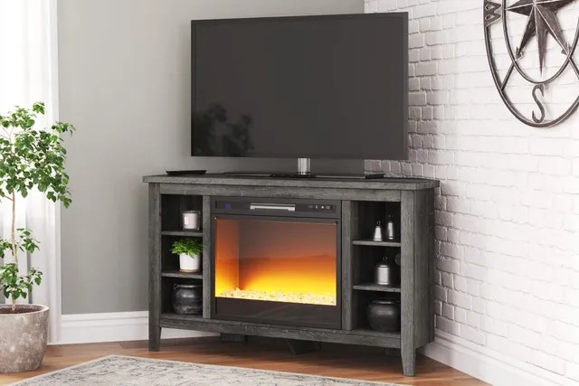 The Signature Design by Ashley Arlenbry collection media console with a TV positioned in a corner 
