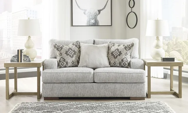 The Benchcraft Mercado collection loveseat in a modern living room 