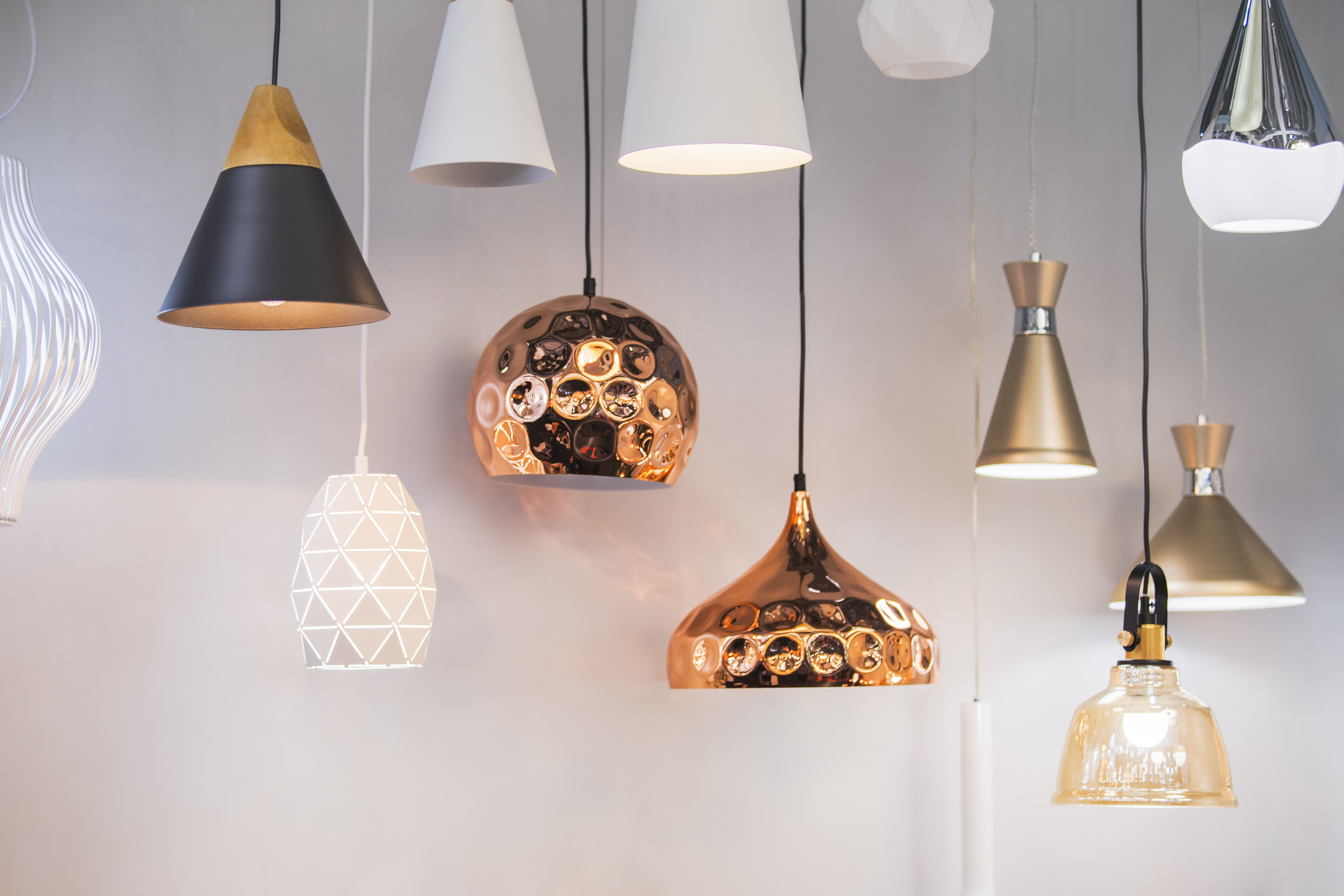 Light fixtures with various metal and glass finishes 
