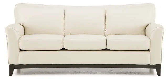 Stock photo of a tan leather Palliser sofa. 