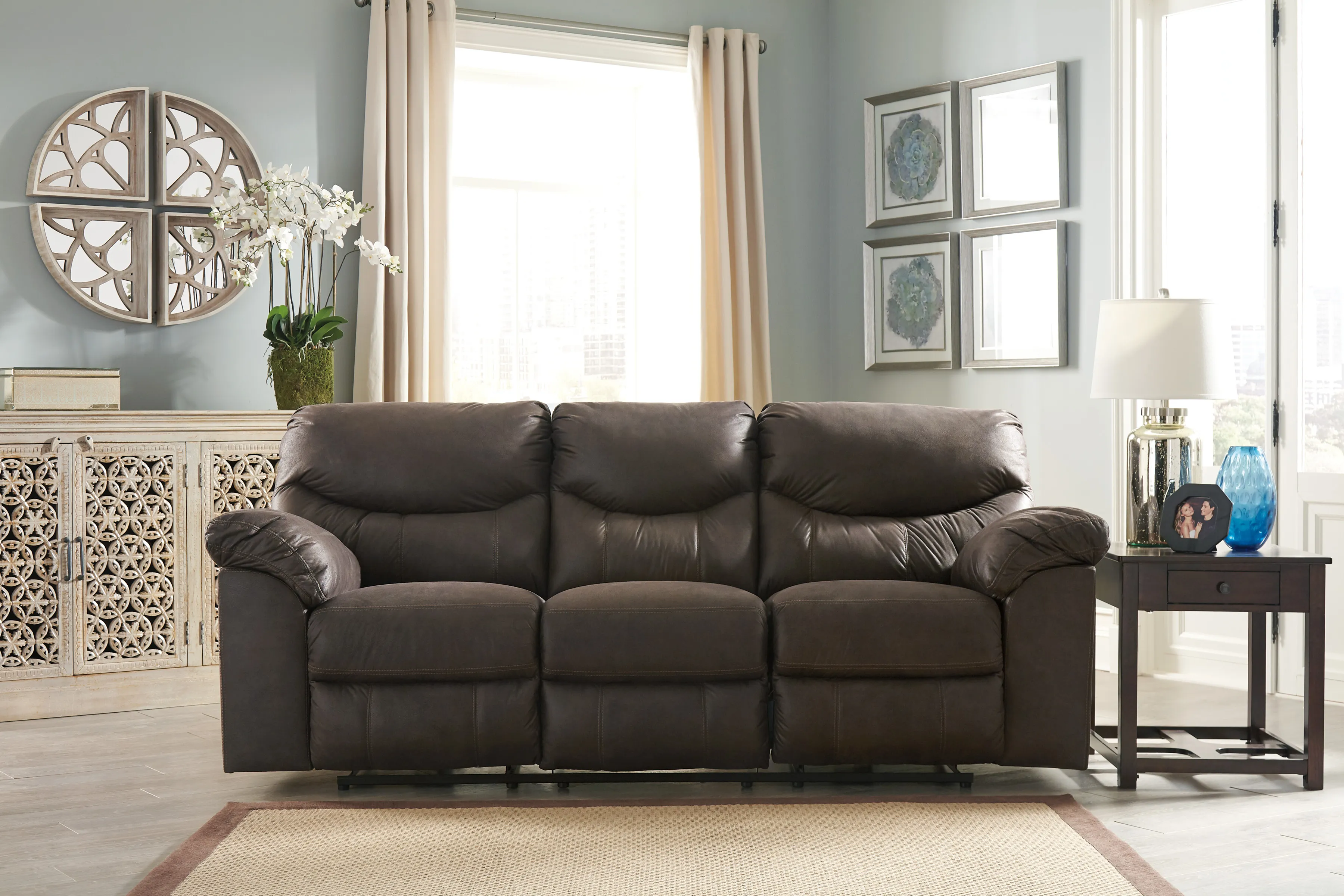 The Signature Design by Ashley Boxberg recliner sofa featured in a living room with contemporary décor 