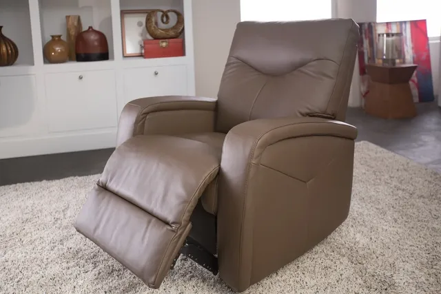 front view of a light brown leather recliner slightly reclined in a modern space