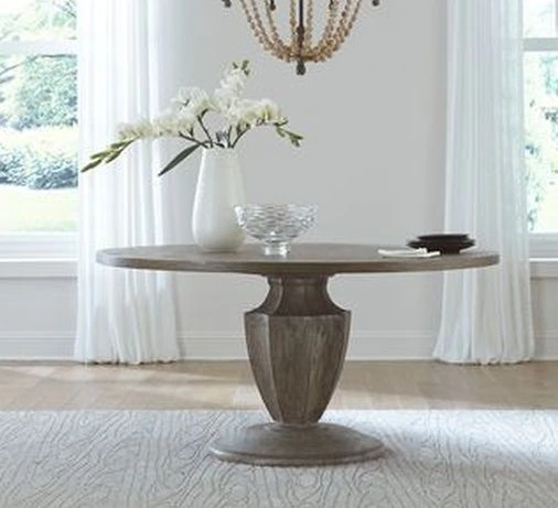 The Liberty Furniture Westfield brown pedestal table in a white-themed setting 