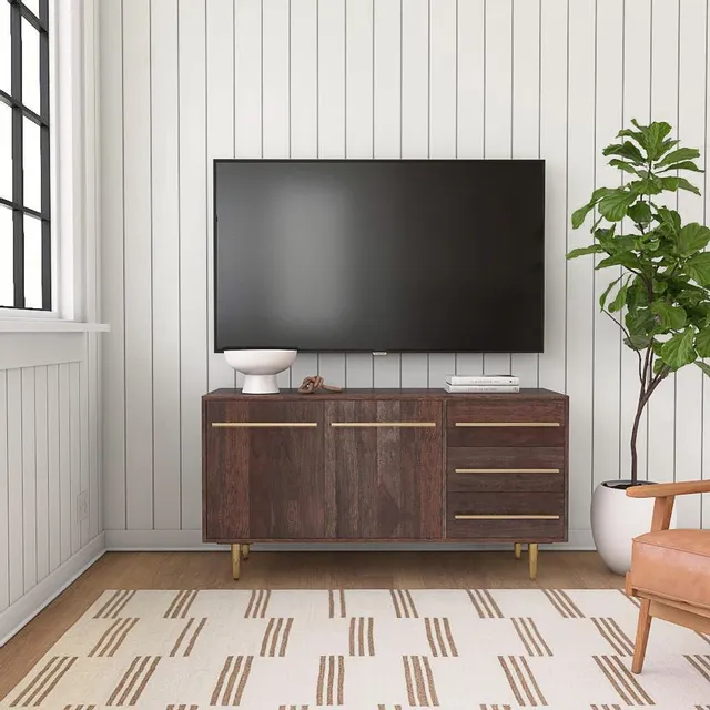 The Powell Home Fashions Keavy collection console with a TV 