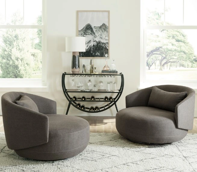 A pair of the Liberty Furniture Haley collection swivel chairs in a living room 