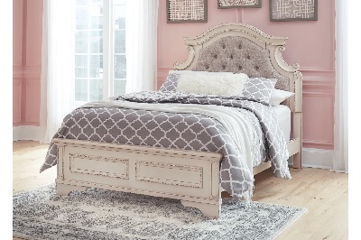 The Signature Design by Ashley Realyn collection panel bed with bedding and décor 