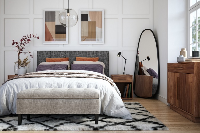 Modern bedroom interior with wooden furniture and full size bed.