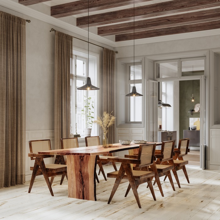 Image of a dining table in modern home. Luxurious interiors of a home with wooden dining table.