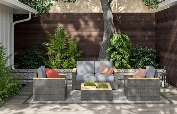 The homestyles Boca Raton 4-piece outdoor seating set in a backyard 