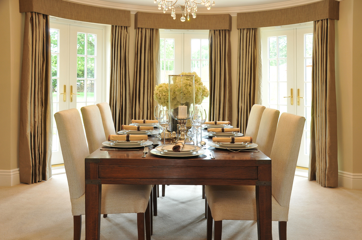 upholstered chairs around rectangular dining table
