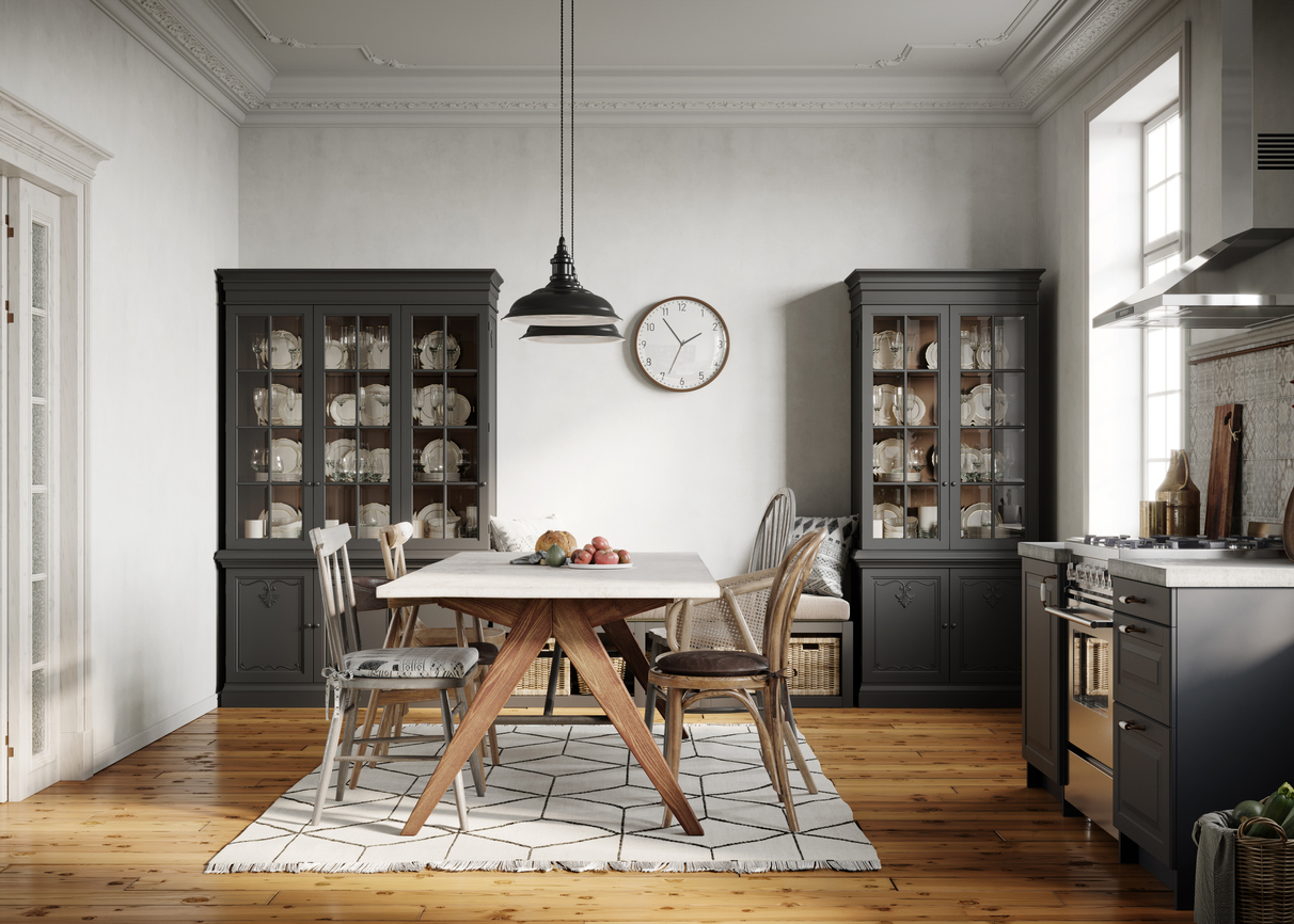 rectangular dining table in room with cabinets at the back 