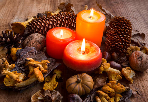 candles surrounded by fall decorations