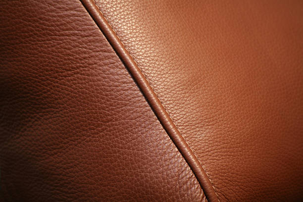 closeup of brown leather couch cushion
