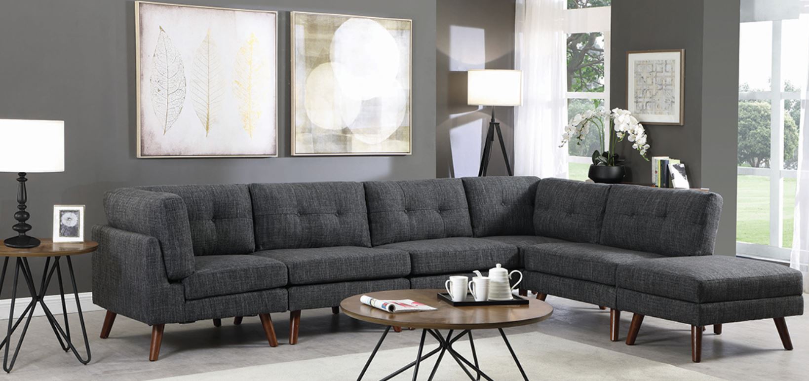 A grey couch in a grey living room