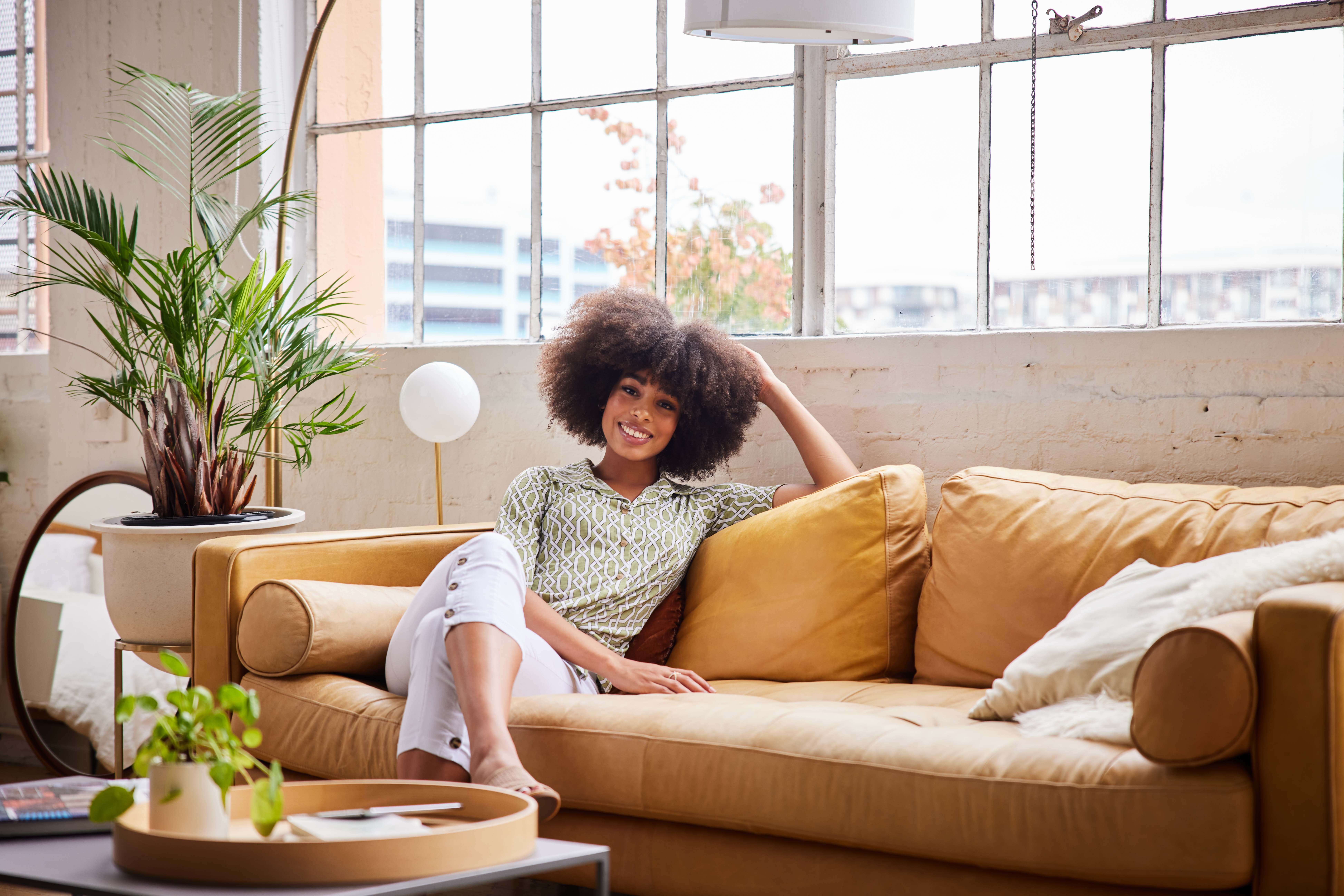 Woman Sitting on Big Comfy Couch