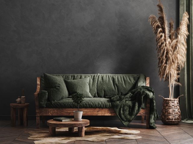 front view of a rustic green sofa in a rustic room