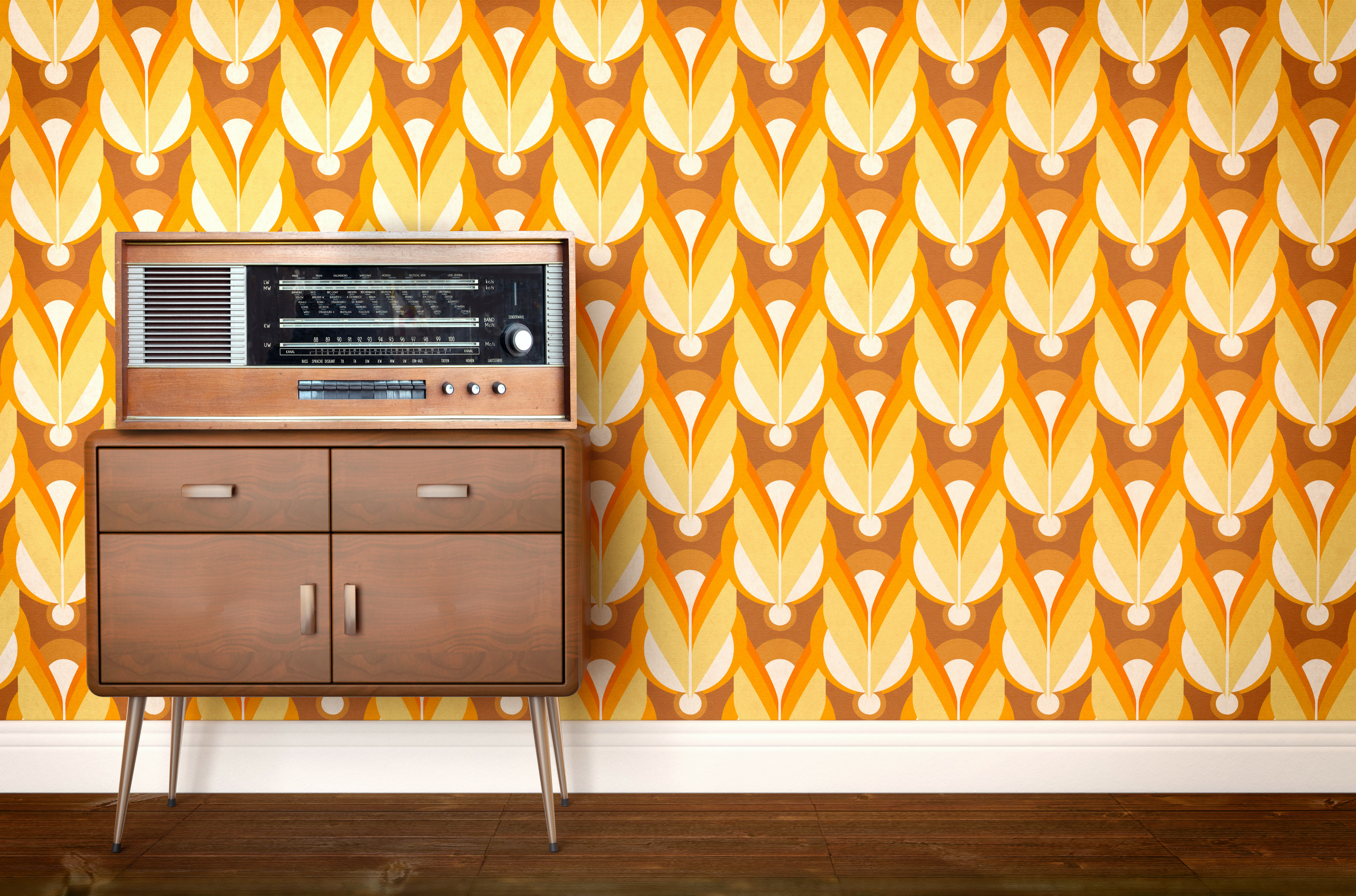 A retro sound system atop a small credenza staged before ’70s-themed orange wallpaper 