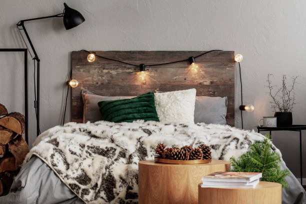 A front view of a rustic bed with a rustic frame and other bedroom furniture 