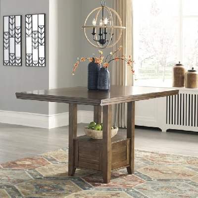 The Benchcraft Flaybern collection extendable dining table with décor 