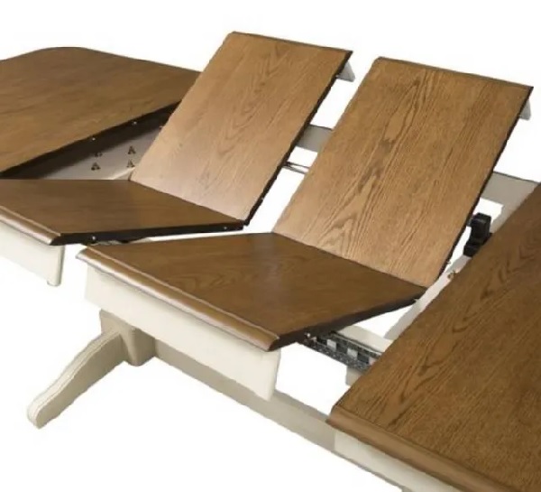 The Liberty Furniture Springfield collection extendable table with its butterfly leaves collapsing 