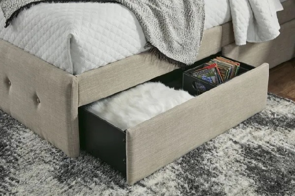 An up-close look at the storage drawer on the Signature Design by Ashley Gladdison storage bed 
