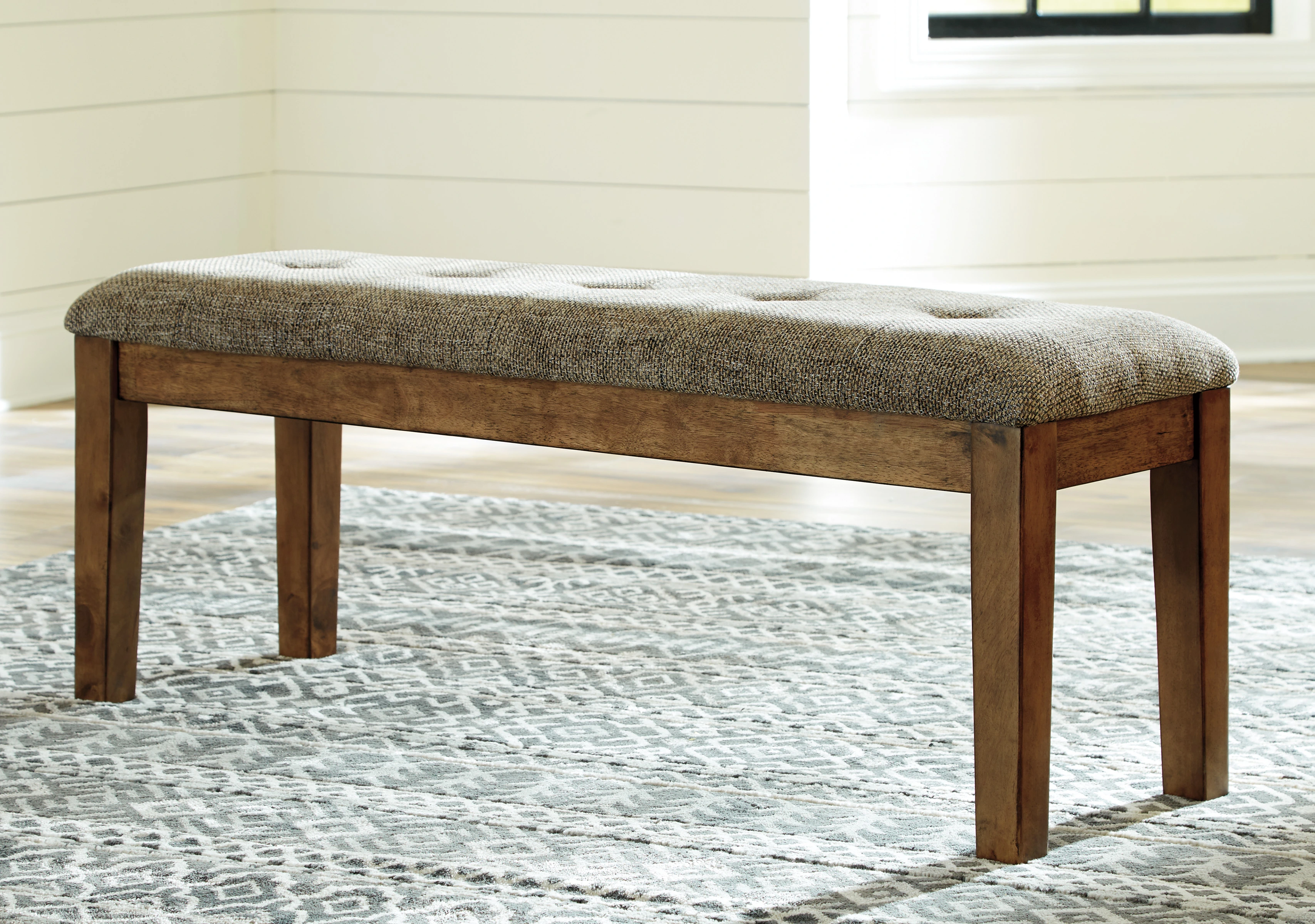 The Benchcraft Flaybern collection dining room bench 