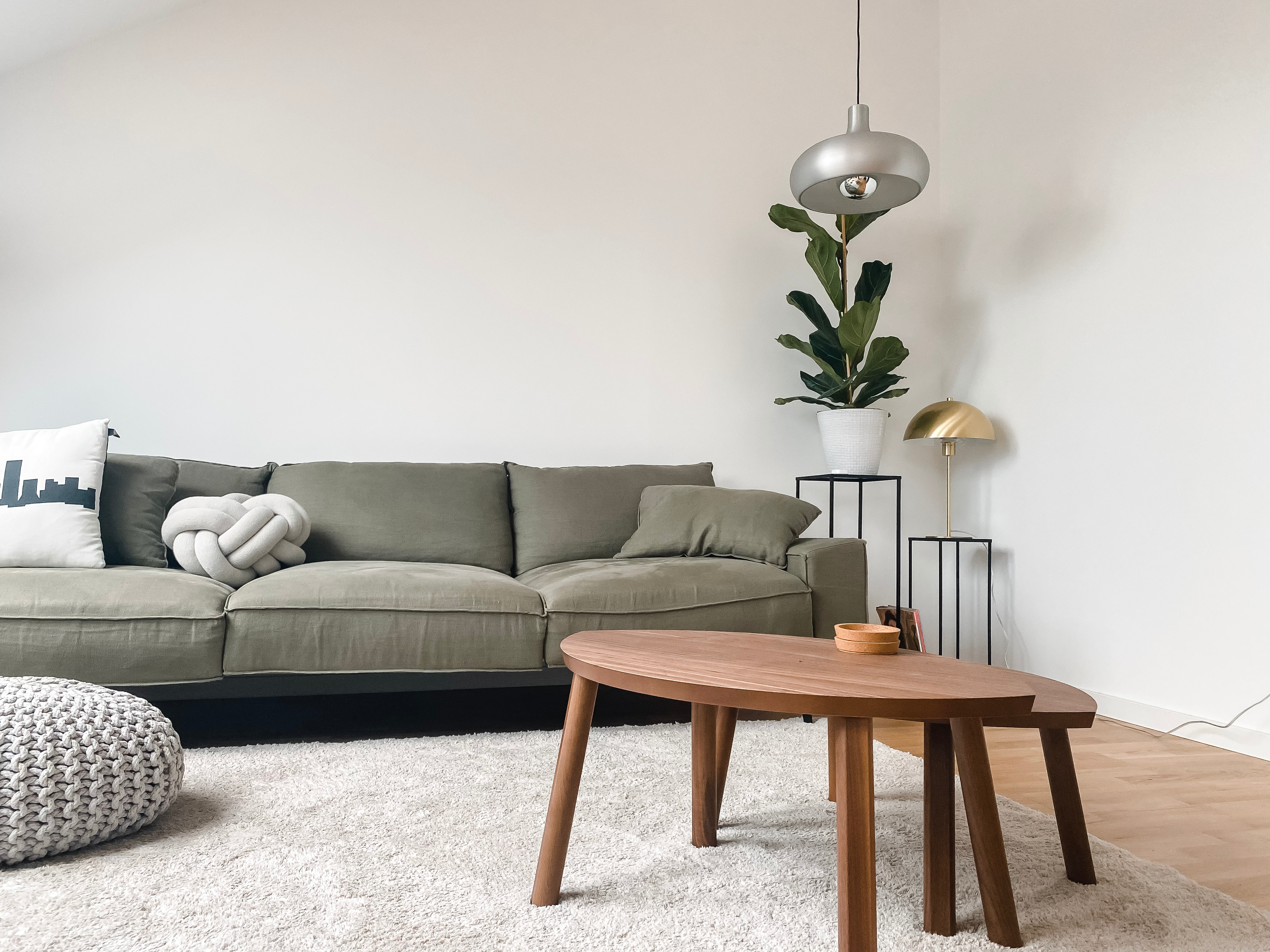 Low profile sofa and wood nesting coffee tables