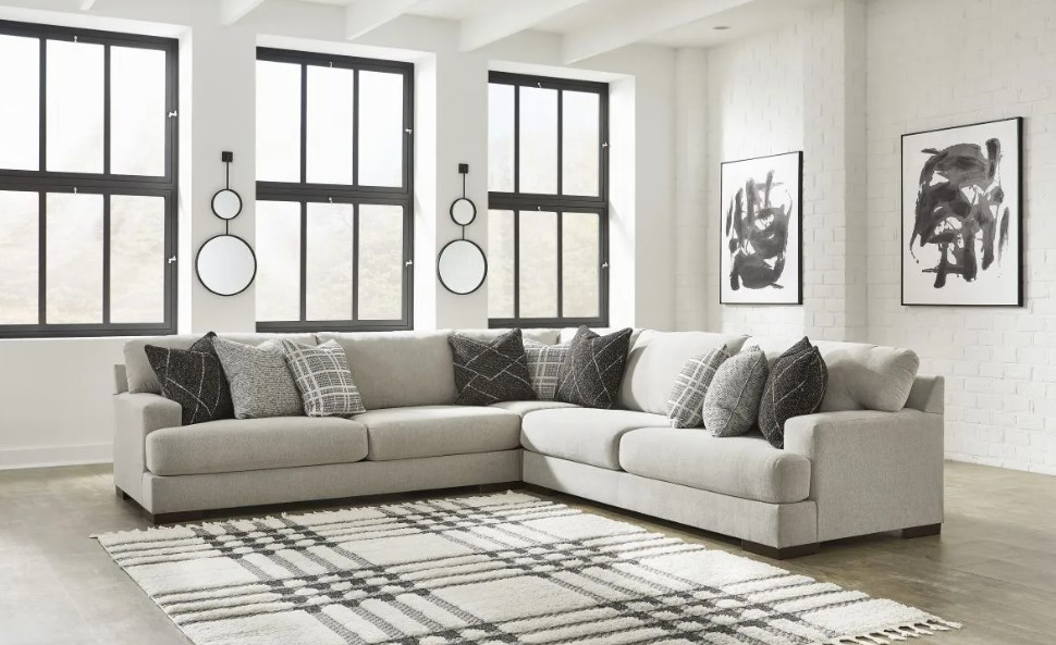 A modern living room with a light grey sectional sofa