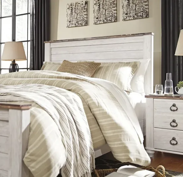 The Signature Design by Ashley Willowton collection bed and dresser in a bedroom with decor