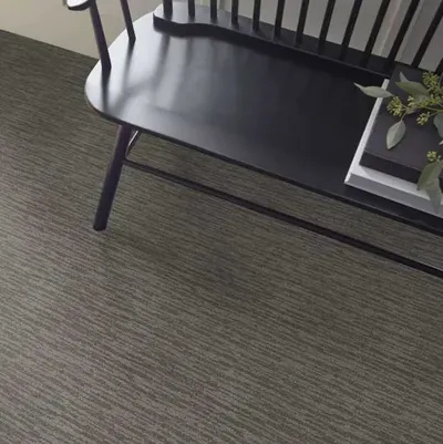 The Shaw Floors Simply the Best Evoking Warmth collection carpeting beneath a bench 