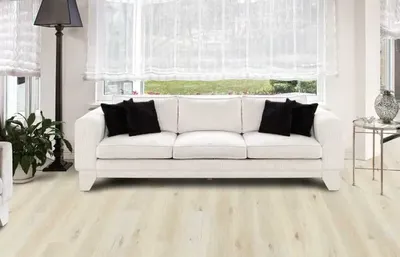 The COREtec Pro Classics collection vinyl flooring with a sofa and décor 