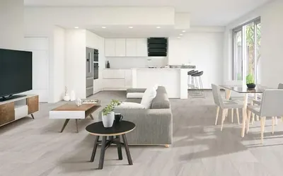 The COREtec Ashani collection vinyl flooring in an open concept living room and kitchen 