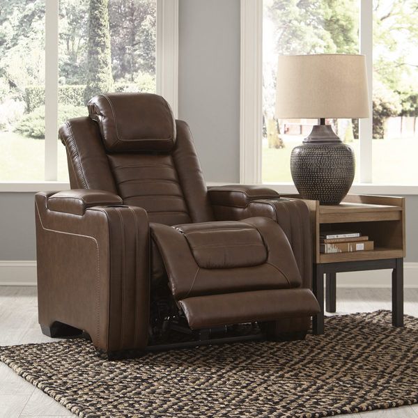 The Signature Design by Ashley Backtrack leather recliner featured with décor 