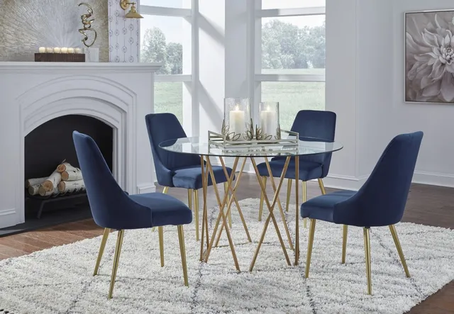 The Signature Design by Ashley Wynora collection table with blue dining chairs and modern décor 