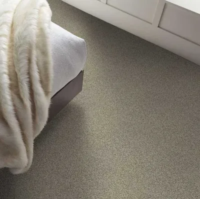 The Shaw Floors Caress collection carpeting in a bedroom 