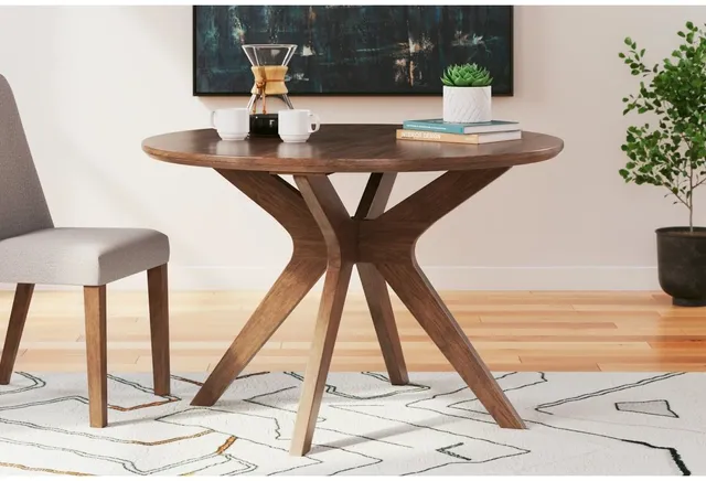 A brown round dining table