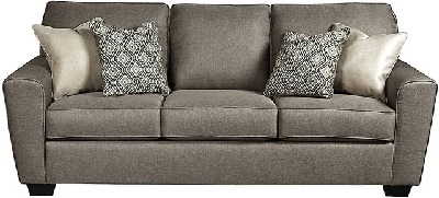 Front view of the Benchcraft Calicho collection queen-size sleeper sofa with décor 