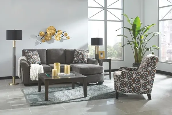 The Benchcraft Brise collection sofa with matching chair in a living room with décor 