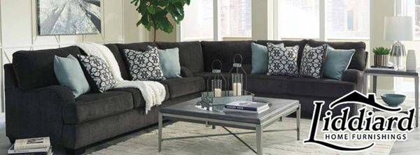 The Liddiard Home Furnishings logo over a sectional sofa with décor 