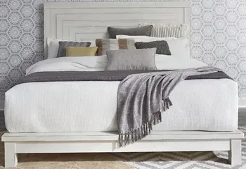 Front view of the Liberty Furniture Farmhouse Flea Market collection platform bed with bedding and décor 