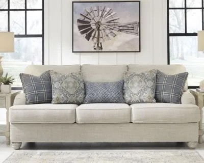 The Benchcraft Traemore sofa with accent throw pillows 