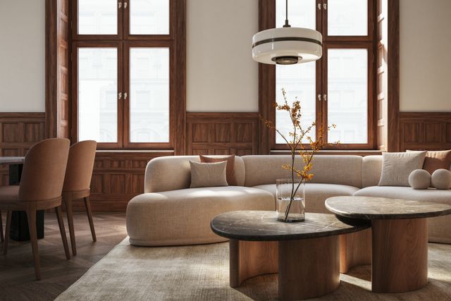 Front view of an art deco living room with light hues and curved furnitures 