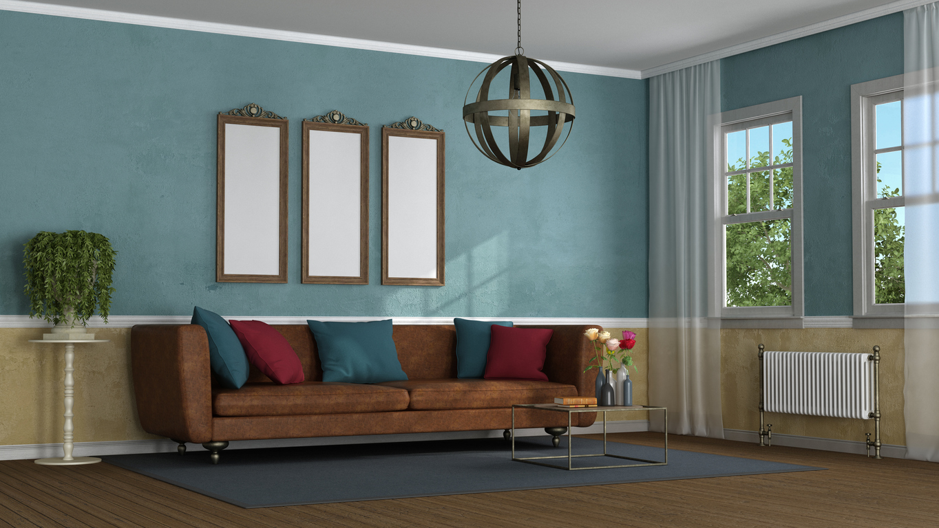 industrial style living room with blue, brown, gold, and maroon furniture