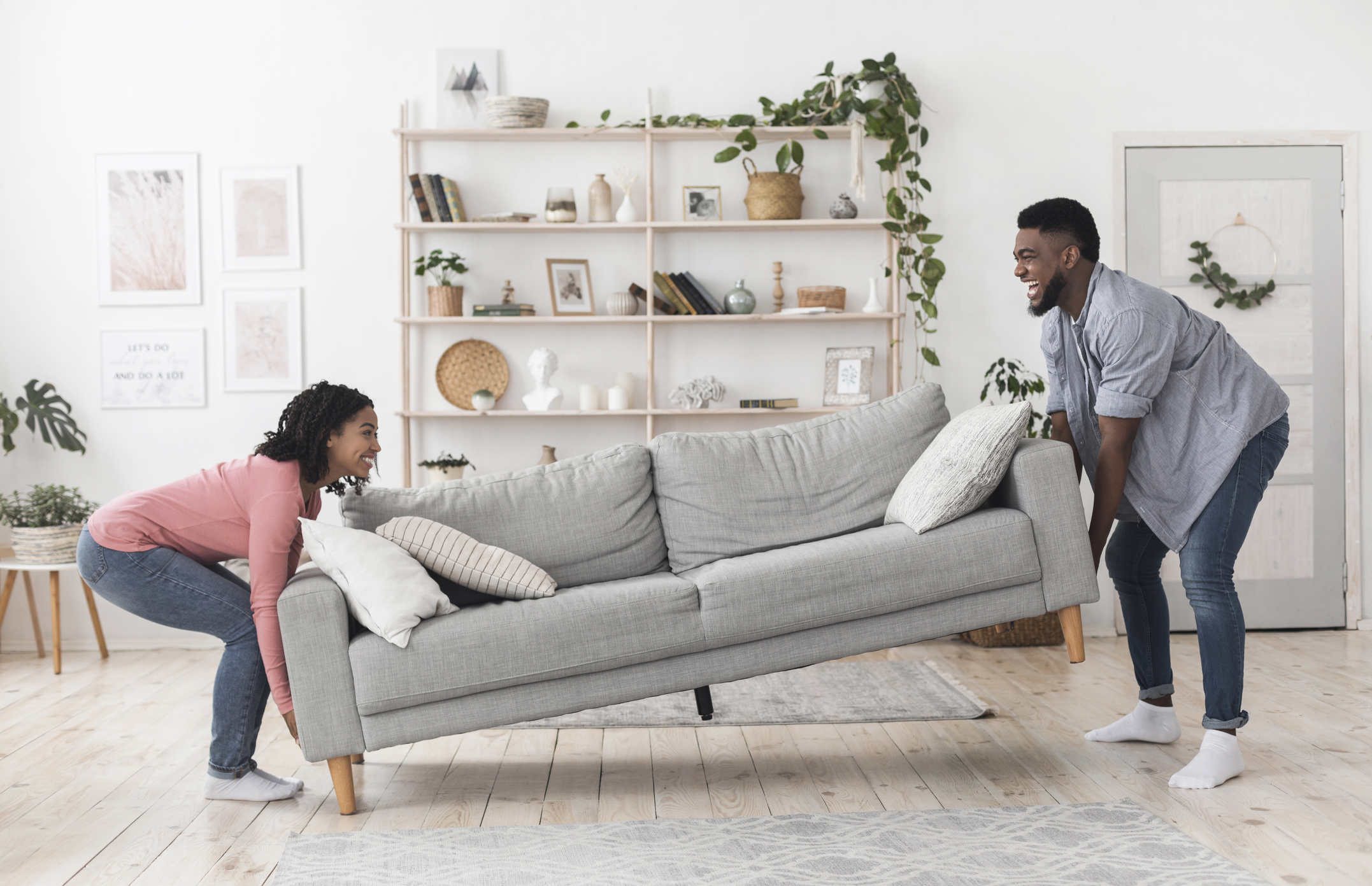 couple moving a couch together