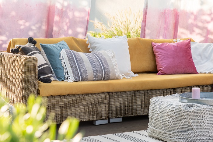 Colorful pillows on a sofa on the terrace.