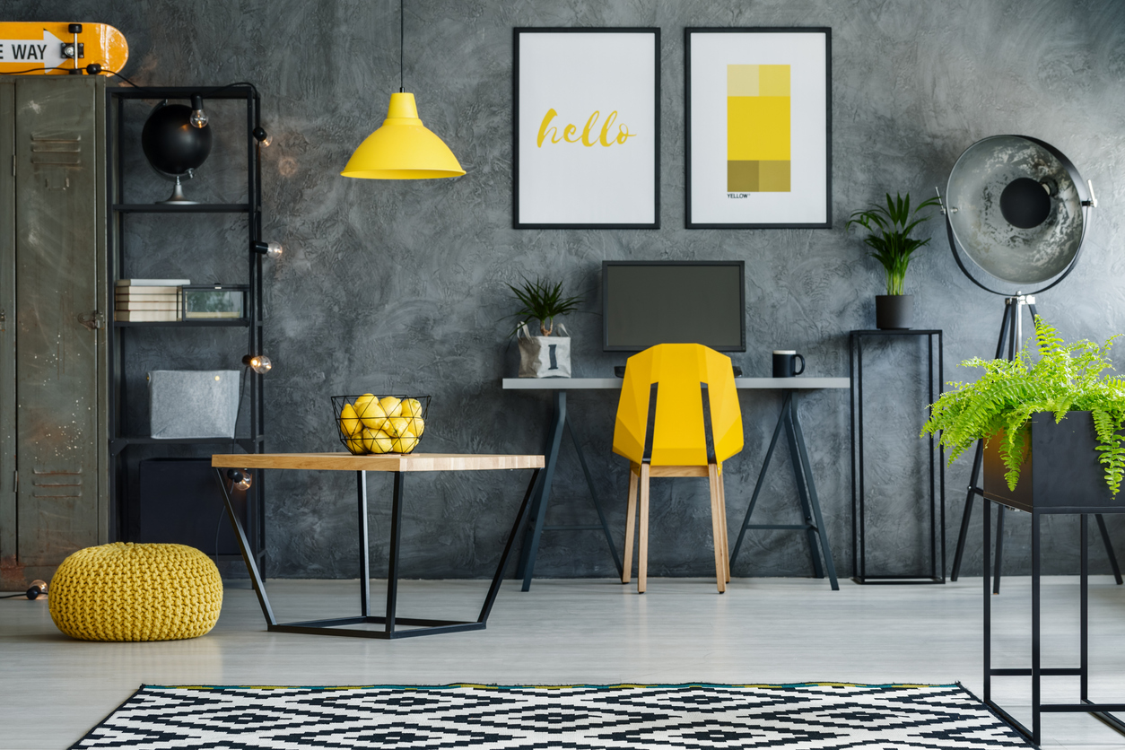 modern home office area in a yellow and gray scheme